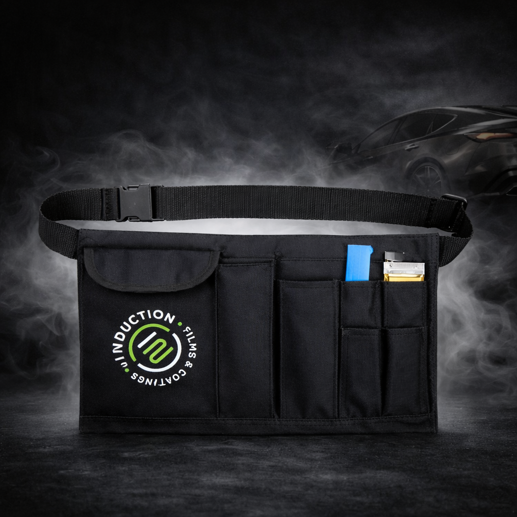 Black tool organizer with pockets on a dark background